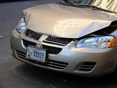 silver brown car with bumped hood